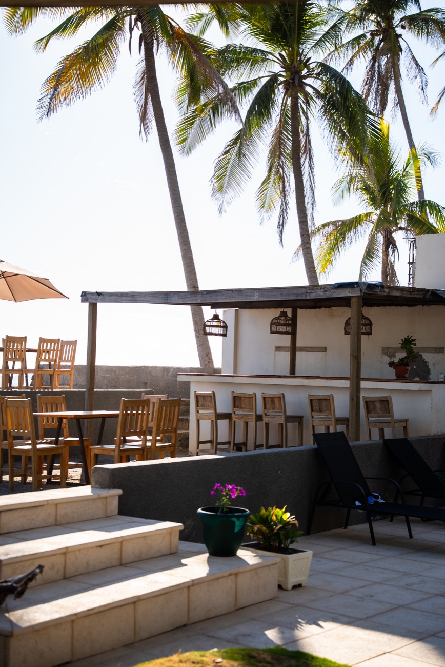 Open-air bar beneath the palms