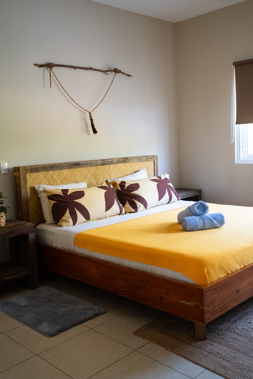 Guest bedroom with warm yellow bedding