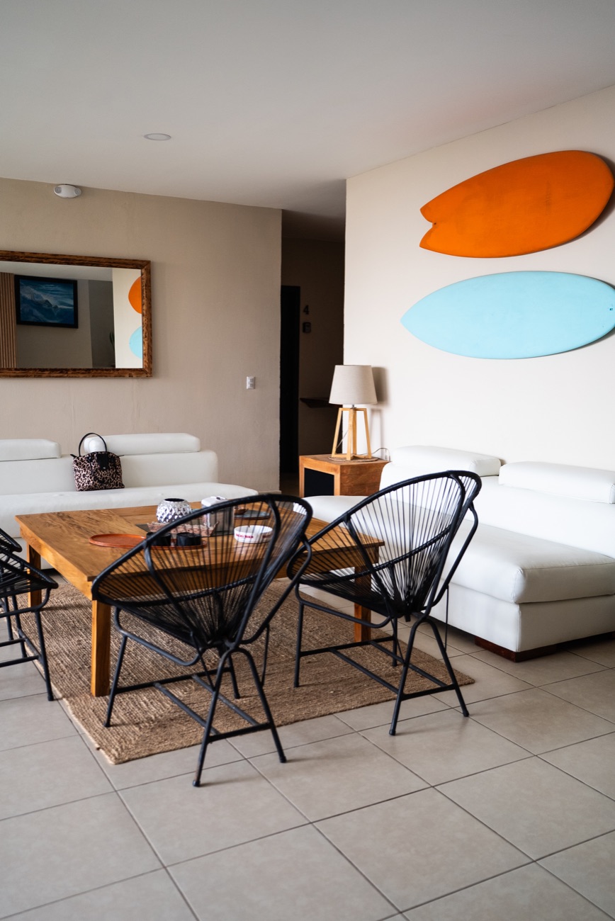 Living room with colorful surfboards